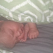 Amelia is registered to the contest to win money with this photo: baby, bed, blanket, child, comfort, cozy, fabric, face, hand, indoors, infant, lying_down, pattern, peace, peaceful, rest, skin, sleeping, soft, young