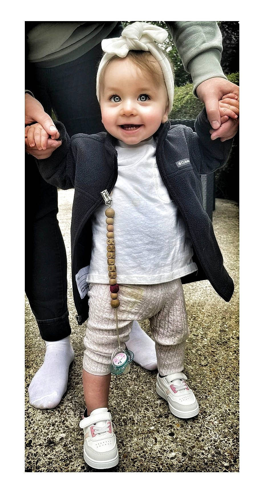 Emilia participe au concours pour gagner de l'argent avec cette photo : baby, baby_toddler_clothing, clothing, collar, face, flash_photography, footwear, gesture, grass, happy, joy, outerwear, people, person, photograph, product, shoe, sleeve, smile, sneakers