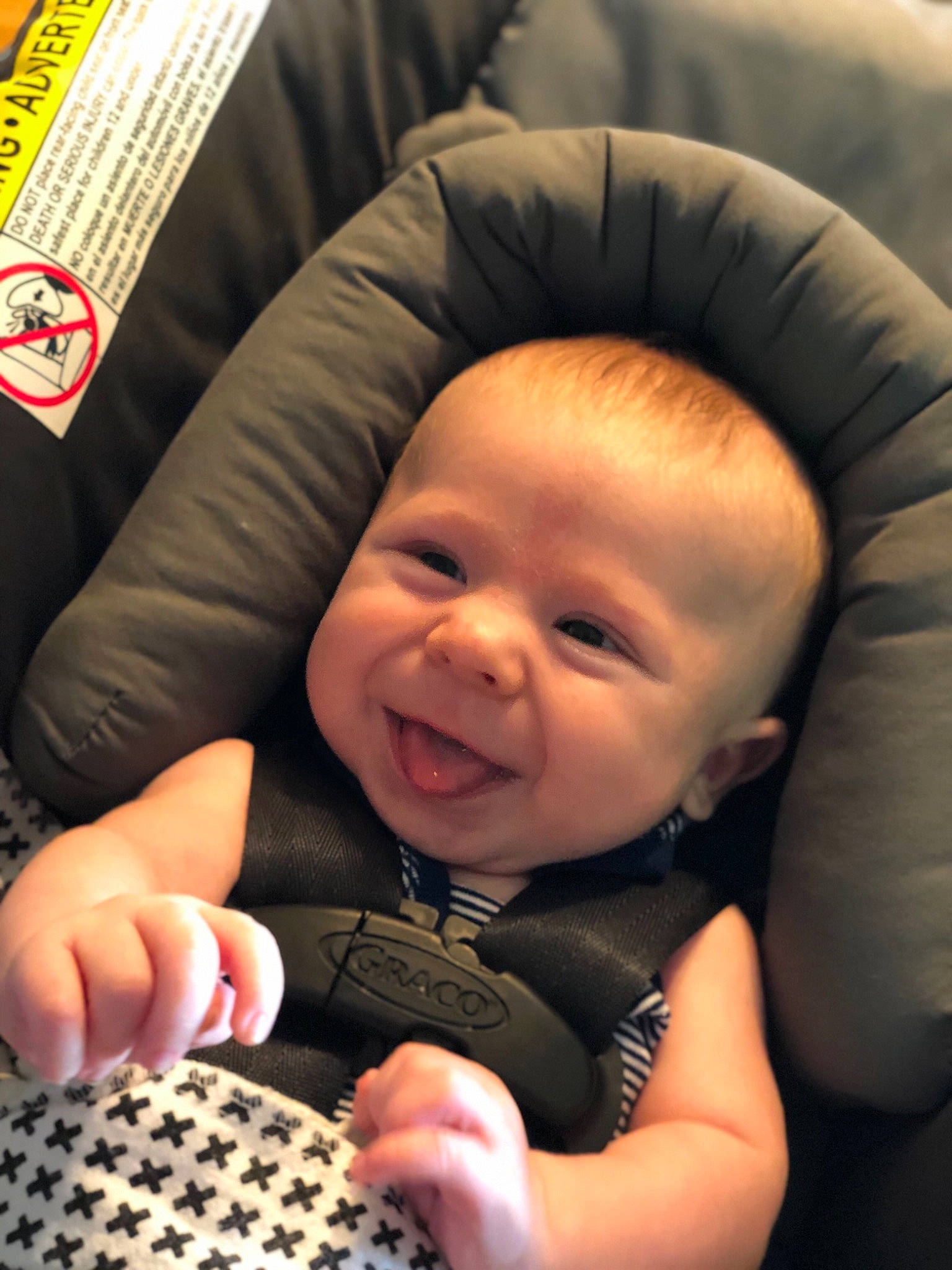 Dominic is registered to the contest to win money with this photo: baby, baby_in_car_seat, child, finger, person, smile, toddler