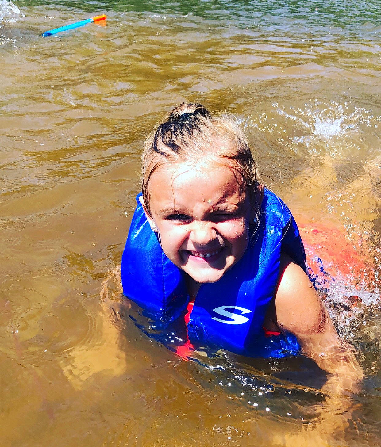 Kaydance is registered to the contest to win money with this photo: fun, happy, joy, leisure, lifejacket, person, personal_protective_equipment, play, recreation, smile, summer, swimming, vacation, vehicle, water