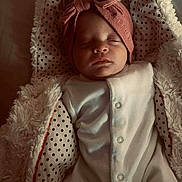 Ivy-Rose is registered to the contest to win money with this photo: baby, sleeping, infant, blanket, polka_dot, headband, bow, soft_fabric, cute, peaceful, indoors, child, newborn, cozy, white_clothing, portrait, closeup, face, resting, warm_lighting
