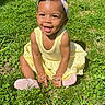 toddler, child, smiling, yellow_dress, headband, grass, outdoor, sunlight, happy, baby, nature, sitting, greenery, cute, portrait, person, daylight, feet, shoes, bracelet