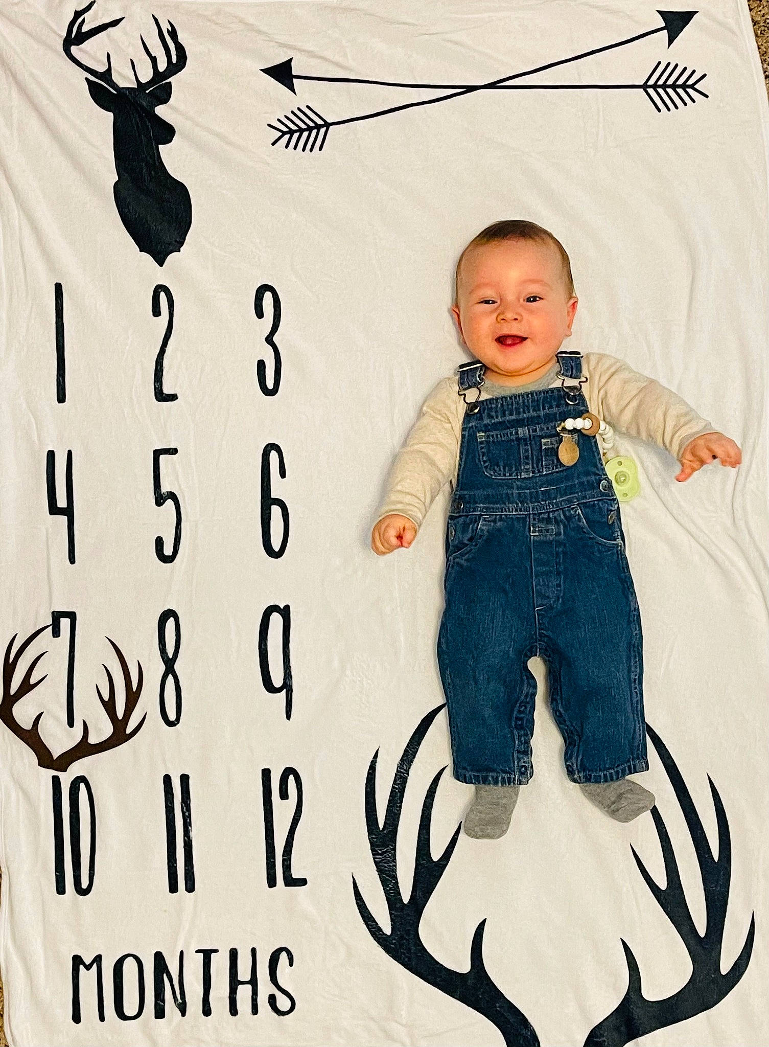 Paxton is registered to the contest to win money with this photo: art, baby, baby_toddler_clothing, child, denim, drawing, facial_expression, font, formal_wear, gesture, happy, illustration, joy, mammal, pattern, person, sleeve, smile, t_shirt, toddler