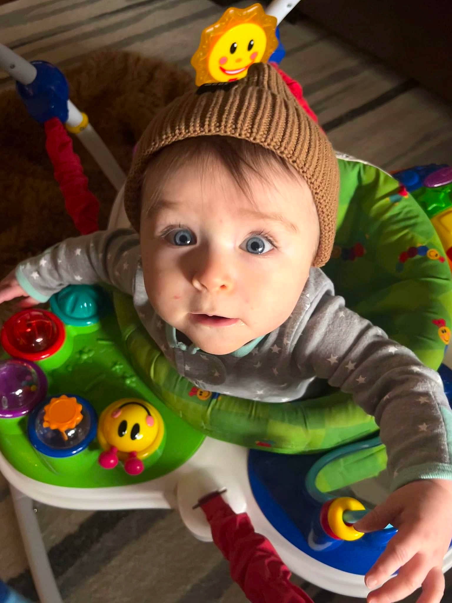 Caspian is registered to the contest to win money with this photo: baby, baby_playing_with_toys, baby_products, baby_toddler_clothing, baby_toys, cap, cheek, child, eye, face, fun, happy, head, iris, person, product, skin, textile, toddler, toy