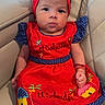 Lizbeth joined the competition — help win amazing prizes! baby, child, red_bow, red_dress, blue_polka_dot, embroidery, el_salvador, sitting, couch, leather_furniture, headband, cute_expression, indoors, infant, portrait, small_hand, comfortable, colorful_clothing, adorable, home