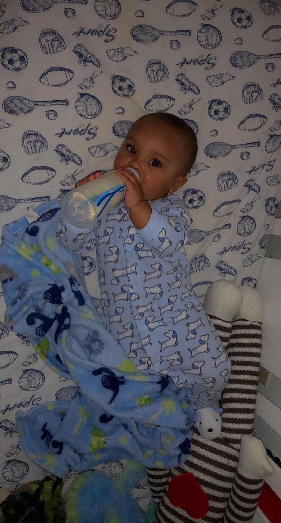 Darius joined the competition — help win amazing prizes! arm, azure, baby, baby_products, baby_safety, baby_toddler_clothing, cheek, child, comfort, flooring, hairstyle, linens, pattern, person, product, room, sitting, skin, sleeve, textile