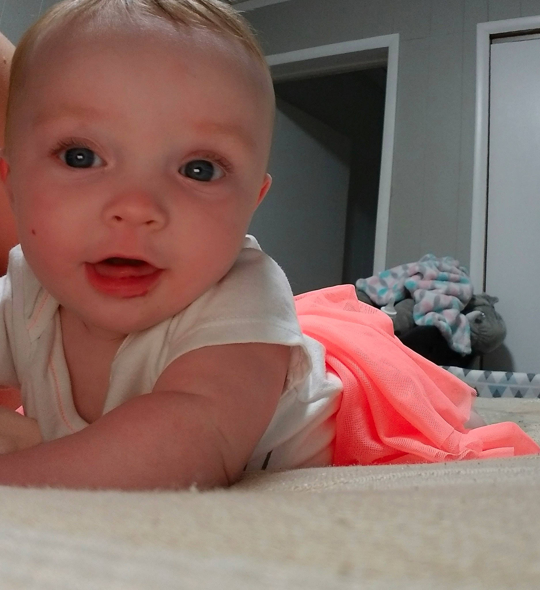 Elizabeth joined the competition — help win amazing prizes! baby, cheek, child, chin, crawling, eye, face, facial_expression, finger, head, iris, lip, mouth, nose, person, pink, sitting, skin, smile, toddler