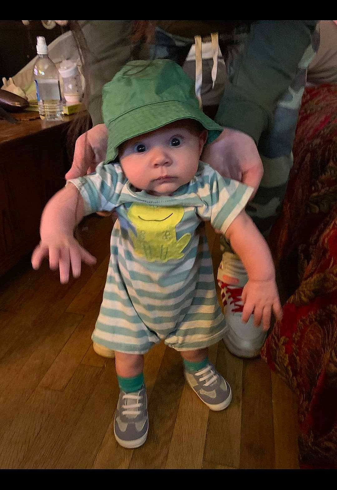 Rylie is registered to the contest to win money with this photo: baby, baby_toddler_clothing, baseball_cap, cap, cheek, child, flooring, fun, happy, hat, headwear, pattern, person, room, sandal, sitting, skin, sleeve, sun_hat, t_shirt