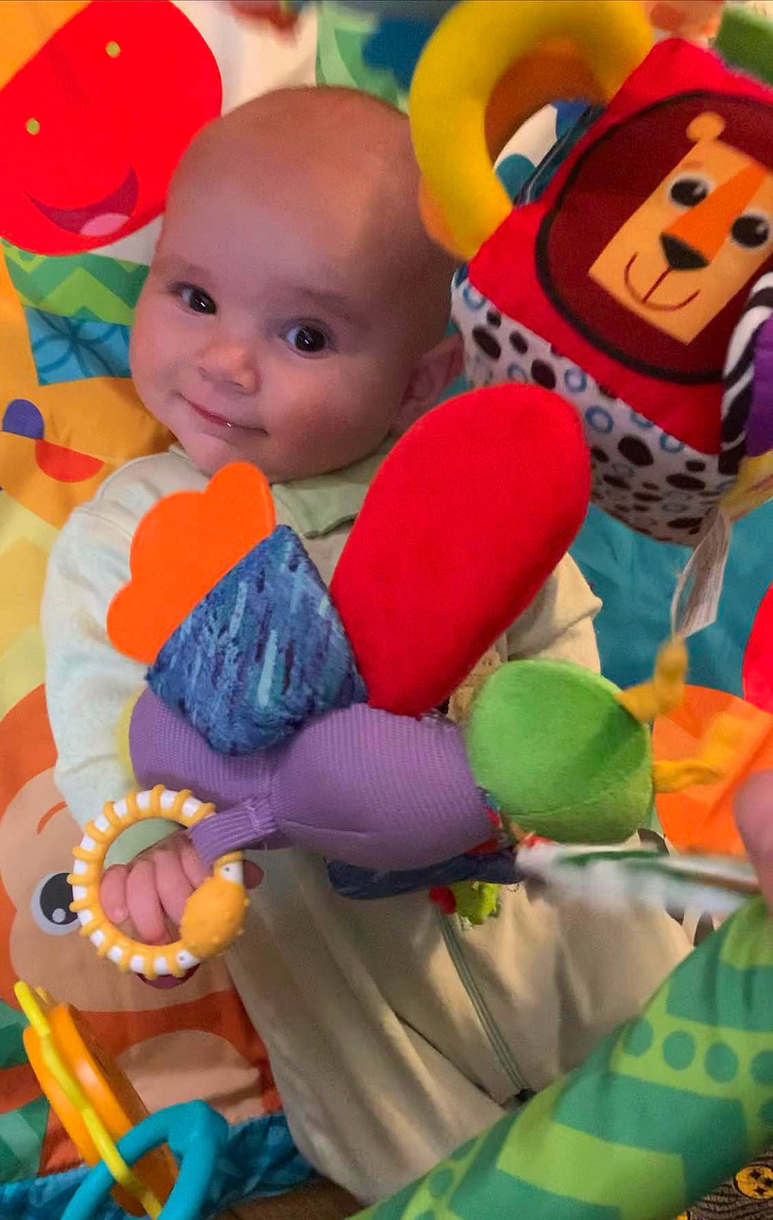Rylie is registered to the contest to win money with this photo: baby, baby_playing_with_toys, baby_products, baby_toddler_clothing, baby_toys, child, event, fun, happy, headgear, orange, party_supply, person, play, plush, room, smile, stuffed_toy, textile, toddler
