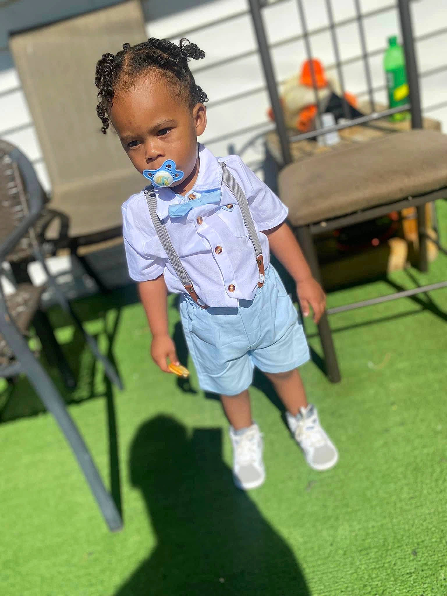 Jacob Scales Jr. is registered to the contest to win money with this photo: baby, chair, child, competition_event, electric_blue, event, eye, eyewear, flooring, fun, grass, head, leisure, person, play, recreation, room, shorts, sitting, t_shirt