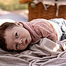 Xavier joined the competition — help win amazing prizes! baby, infant, blanket, outdoor, sunlight, face, portrait, curious, head, clothing, basket, soft, laying, nature, daylight, child, expression, relaxation, skin, young