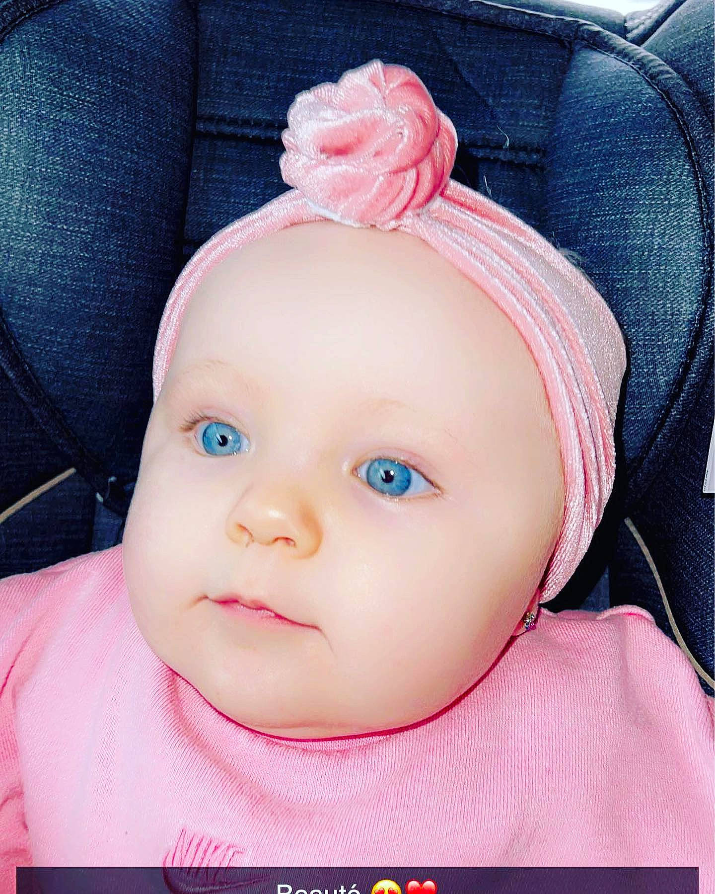 Estrélya participe au concours pour gagner de l'argent avec cette photo : baby, baby_toddler_clothing, cap, cheek, child, cool, dress, electric_blue, eyelash, happy, headband, headwear, magenta, neck, person, pink, skin, sleeve, textile, toddler