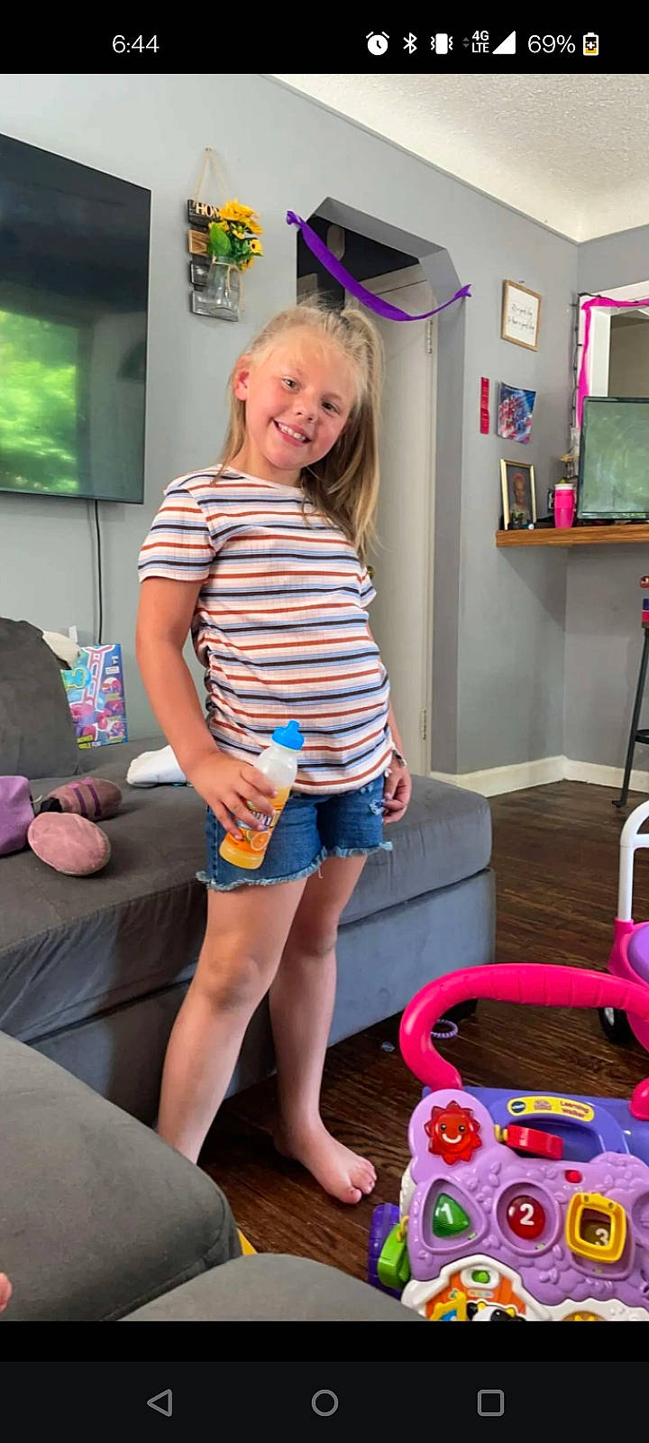 Evelina is registered to the contest to win money with this photo: blond, child, electric_blue, event, fun, happy, human_leg, jean_short, joy, knee, leisure, magenta, person, picture_frame, pink, play, shorts, smile, snapshot, t_shirt