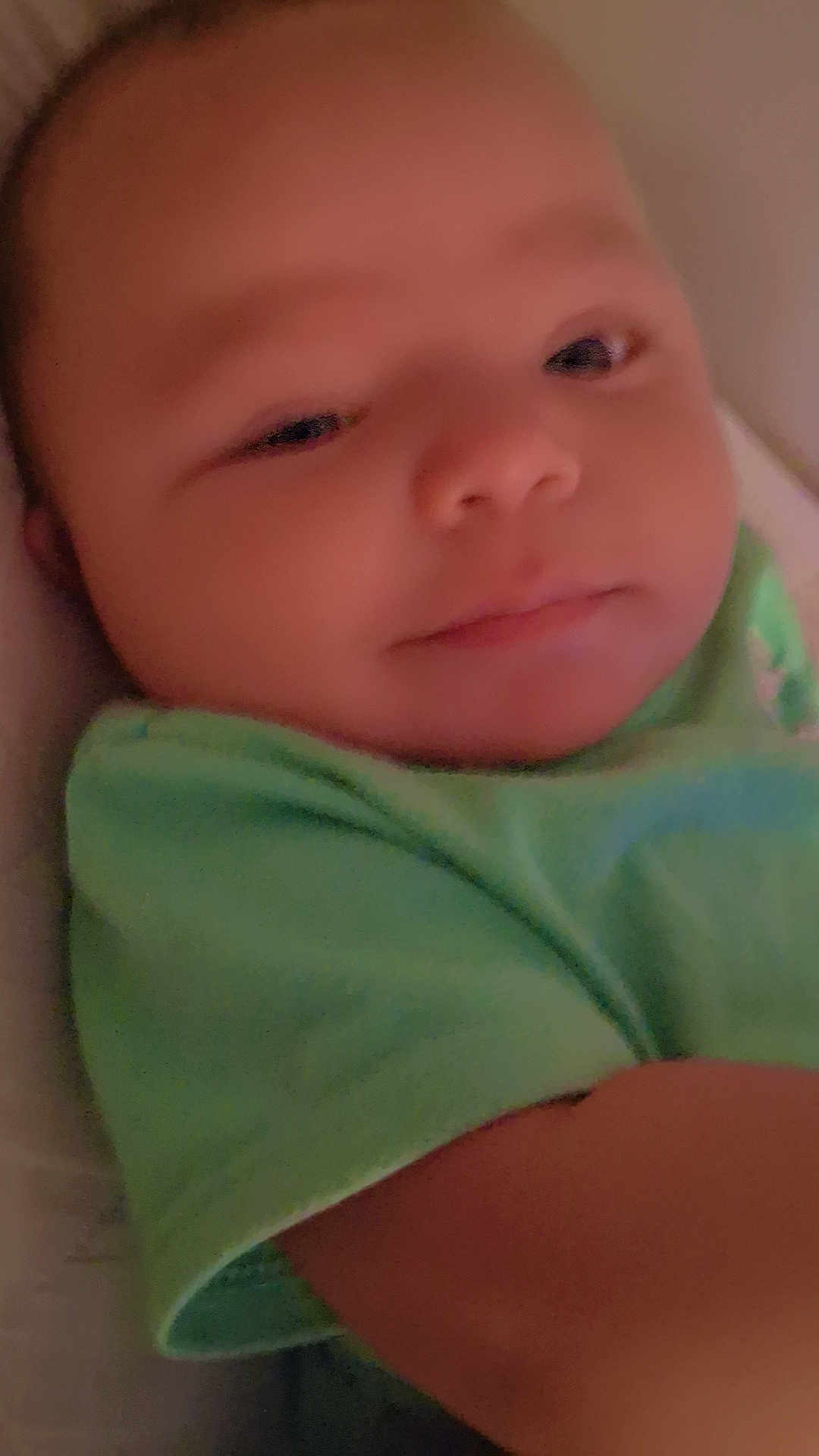 Blake joined the competition — help win amazing prizes! baby, infant, face, child, green_shirt, closeup, sleepy, soft_lighting, skin, portrait, young, person, cute, indoors, head, expression, resting, baby_clothes, newborn, warm_tone