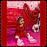 baby, bunny, celebration, child, colorful, cute, decorations, festive, heart, indoor, lollipop, pink_shoes, plush_toy, portrait, red_dress, sitting, stickers, toddler, valentine, young_child