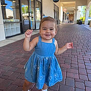 Ashley joined the competition — help win amazing prizes! toddler, child, smiling, blue_dress, sneakers, outdoor, brick_walkway, shopping_center, happy, person, sunny, daylight, casual_clothing, young_child, cute, walking, small_hair_tie, footwear, playful, portrait
