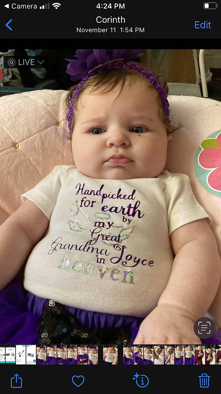 Joycelynn is registered to the contest to win money with this photo: arm, baby, baby_toddler_clothing, cheek, cool, eyelash, face, facial_expression, hairstyle, happy, iris, mammal, person, photograph, pink, product, purple, skin, textile, toddler