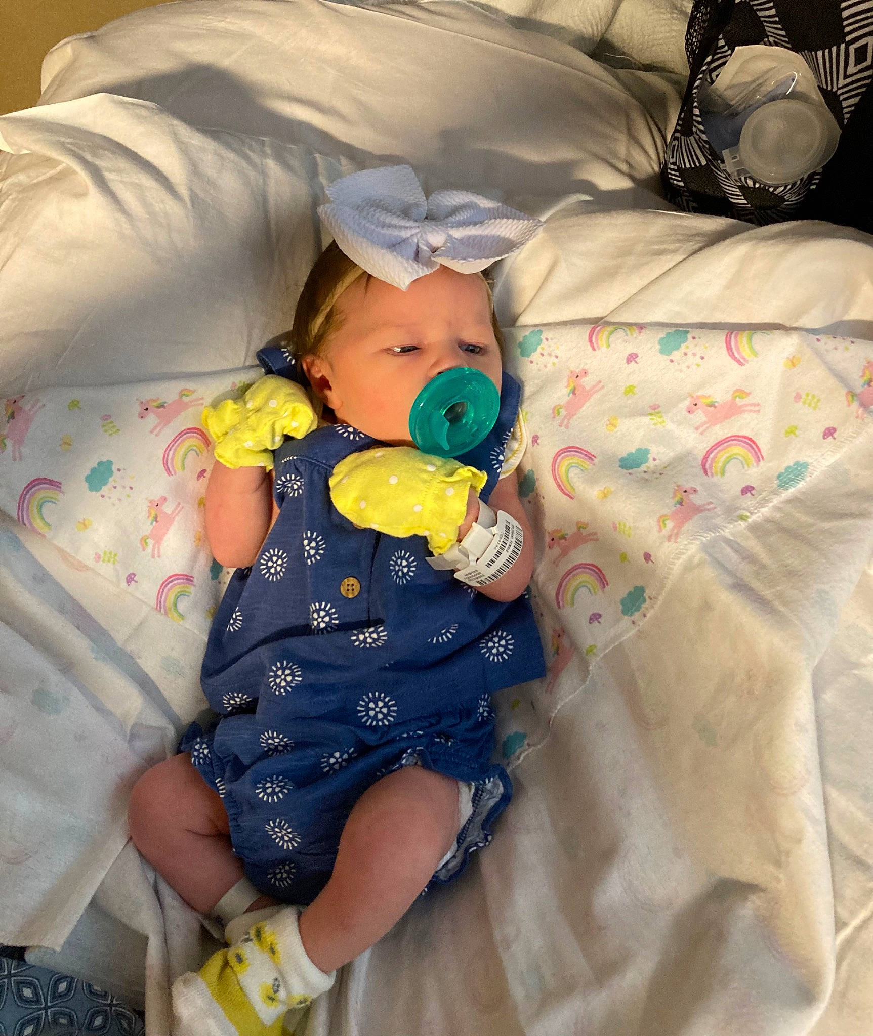 Joycelynn is registered to the contest to win money with this photo: arm, baby, baby_products, baby_sleeping, baby_toddler_clothing, child, comfort, hand, happy, hat, linens, pattern, person, pink, sitting, skin, sleeve, textile, toddler, white