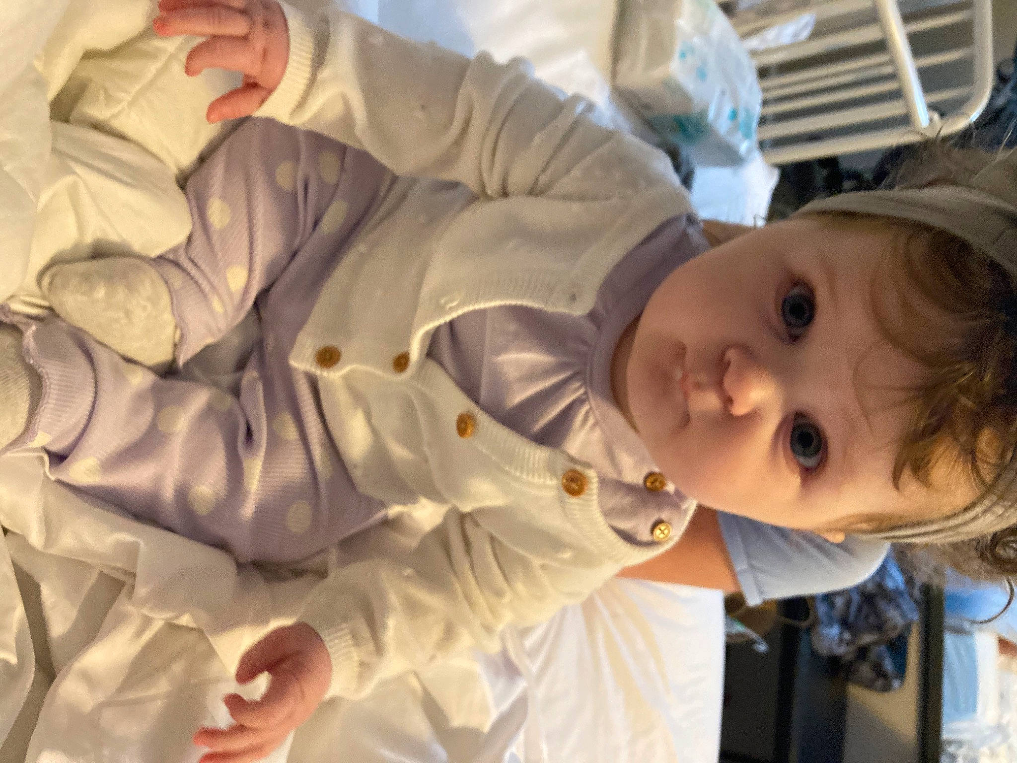 Joycelynn is registered to the contest to win money with this photo: baby, baby_toddler_clothing, cheek, child, comfort, fun, gesture, happy, hat, mouth, nose, people, person, room, sitting, toddler, uniform