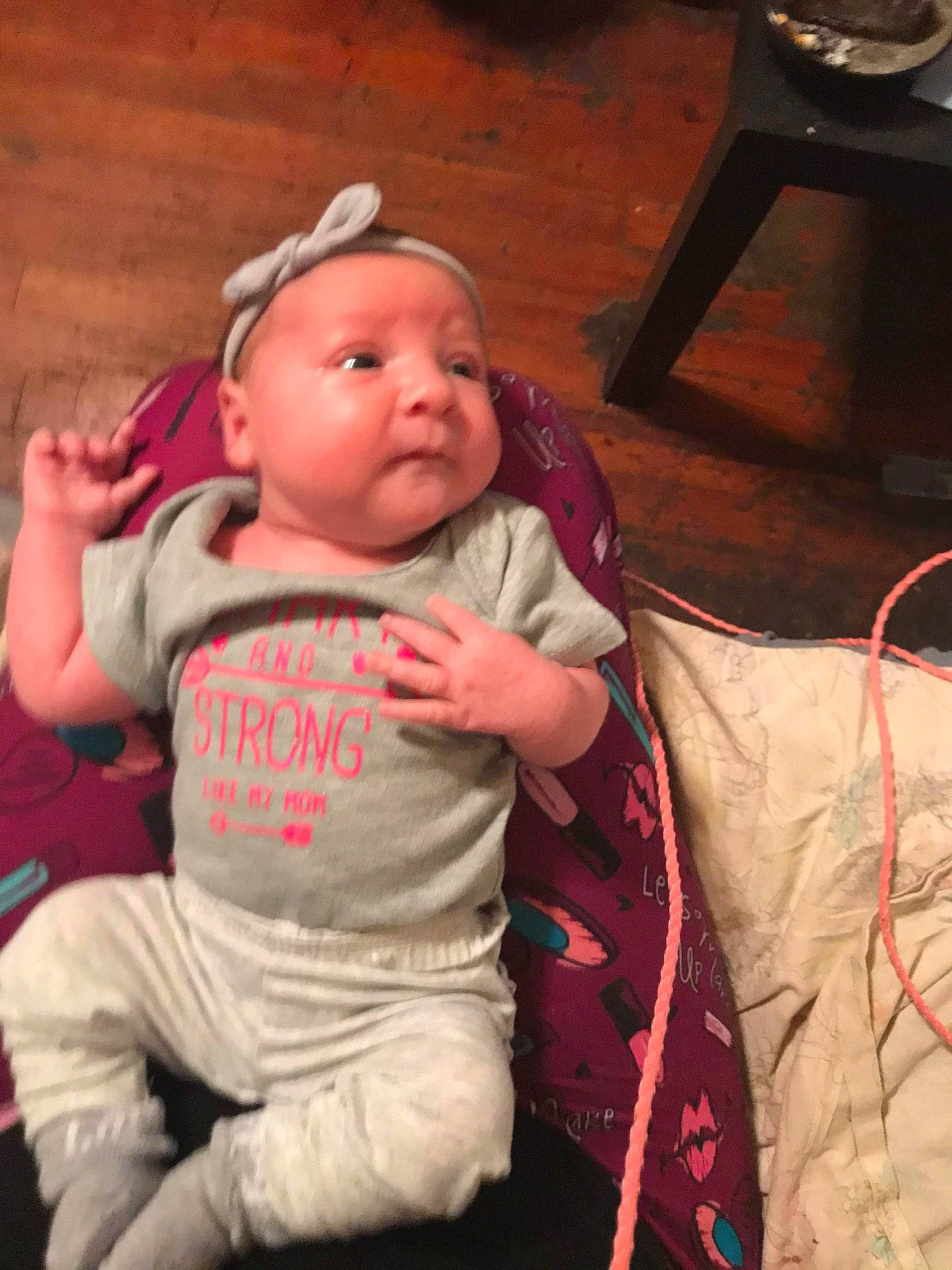 Phoenix joined the competition — help win amazing prizes! baby, baby_toddler_clothing, chair, cheek, child, comfort, facial_expression, finger, fun, happy, head, lap, mammal, mechanical_fan, mouth, muscle, person, room, skin, t_shirt