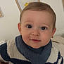 Noélio a rejoint le concours — aidez-le/la à gagner de superbes lots ! baby, bib, child, clothing, cute, expression, eyes, face, hair, hand, head, indoor, infant, knitwear, person, portrait, skin, striped, sweater, young