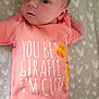 Aiyana is registered to the contest to win money with this photo: baby, bed, blanket, child, clothing, cute, expression, face, giraffe, heart_pattern, infant, lying_down, newborn, onesie, pacifier, pink, resting, skin, soft_toys, teal