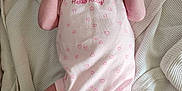 Aiyana is registered to the contest to win money with this photo: baby, blanket, child, cute, face, hand, hello_kitty, indoors, infant, lying_down, newborn, onesie, pacifier, person, pink, sleepwear, small, socks, soft_texture, white
