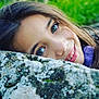 Edene a rejoint le concours — aidez-le/la à gagner de superbes lots ! child, closeup, expression, eyebrows, face, girl, green_eyes, hair, happy, head, moss, nature, outdoor, person, portrait, resting, rock, skin, smile, young