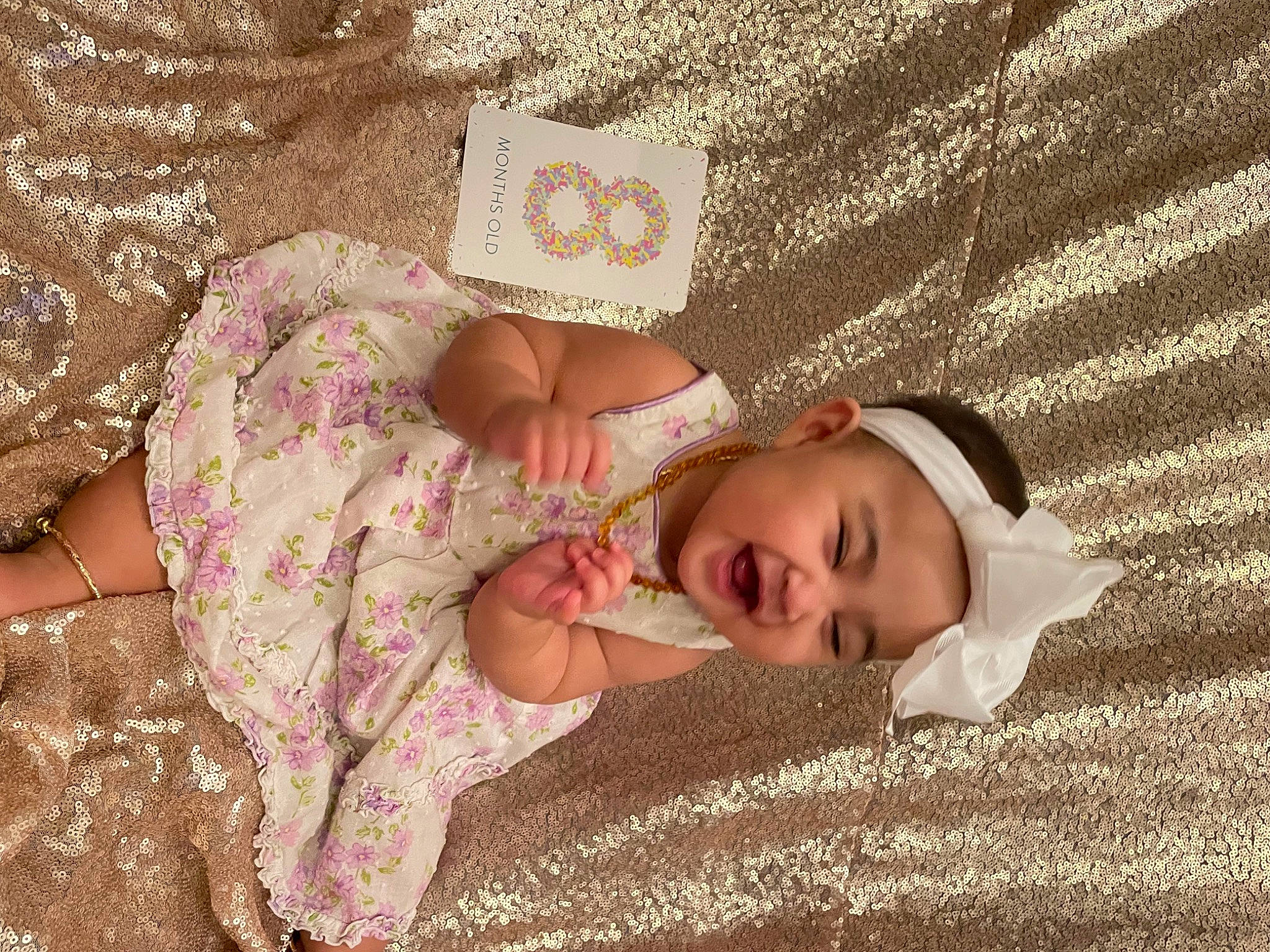 Kaelani joined the competition — help win amazing prizes! child, dress, fashion_accessory, flooring, fun, grass, happy, head, headwear, human_body, linens, pattern, peach, people_in_nature, person, plant, sand, skin, textile, toddler