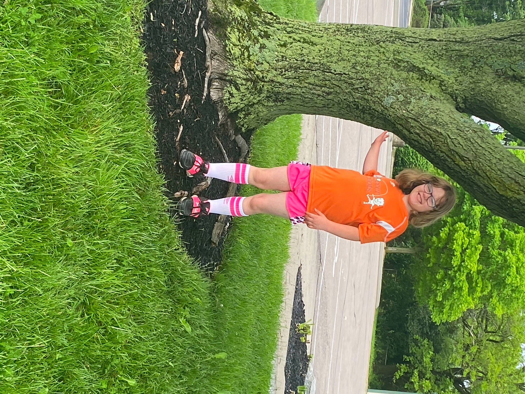 Hannah is registered to the contest to win money with this photo: fun, grass, grass_family, green, happy, joy, landscape, leisure, people_in_nature, person, plant, plant_stem, recreation, shrub, smile, sports_equipment, tree, trunk, water