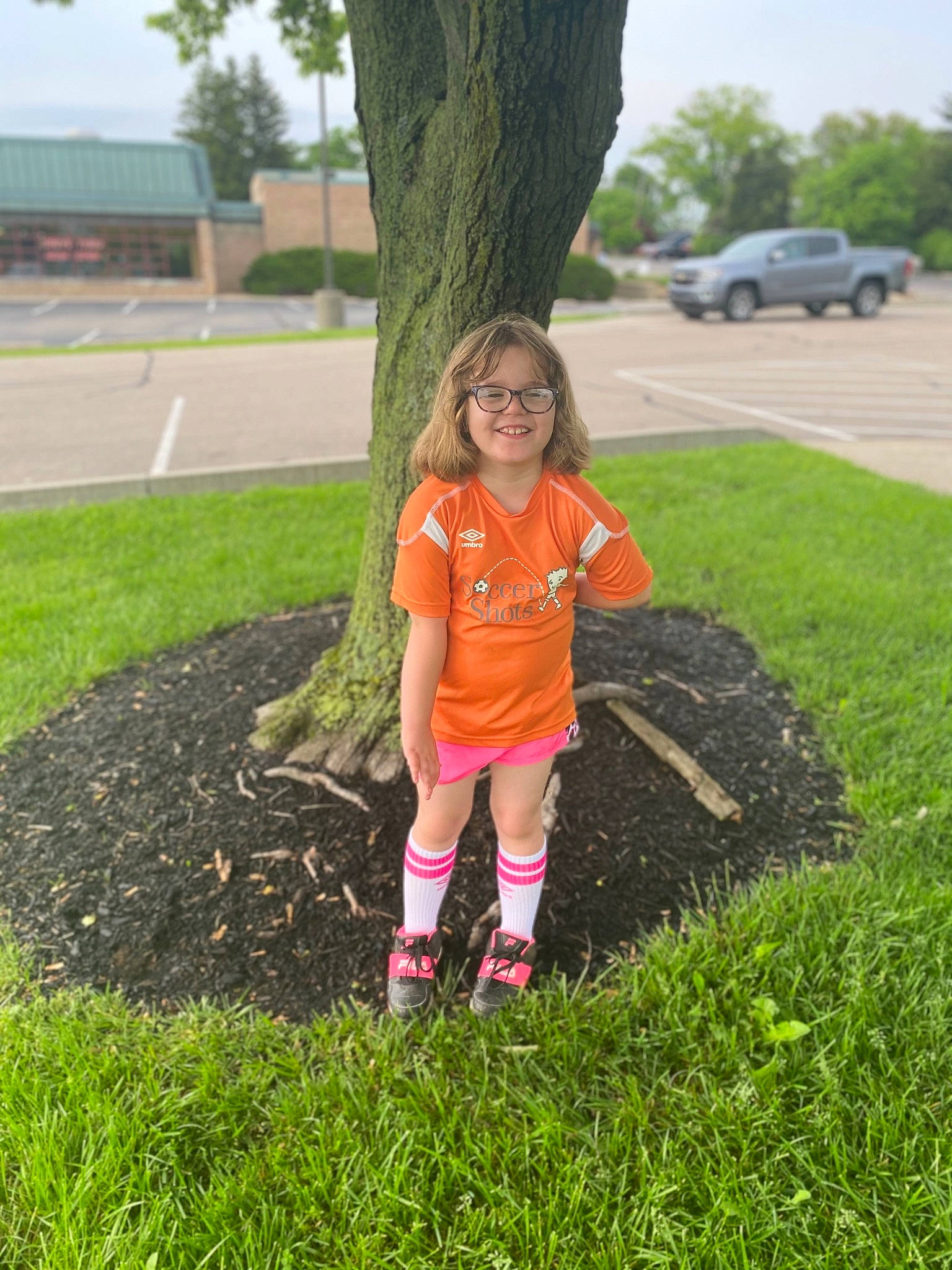 Hannah is registered to the contest to win money with this photo: asphalt, car, fun, grass, grass_family, grassland, groundcover, happy, joy, landscape, lawn, leaf, leisure, people_in_nature, person, plant, recreation, shoe, sky, toddler