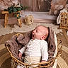 baby, basket, blanket, cozy, yawning, infant, wooden_floor, decor, plant, woven, soft_toys, neutral_colors, indoors, cute, sleepy, portrait, child, warm_lighting, home, comfy