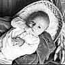 Thélyo a rejoint le concours — aidez-le/la à gagner de superbes lots ! baby, infant, basket, blanket, black_and_white, cozy, cute, dried_plants, face, hand, indoors, laying, looking_at_camera, monochrome, person, portrait, sucking_fingers, soft_texture, wood_floor, young_child