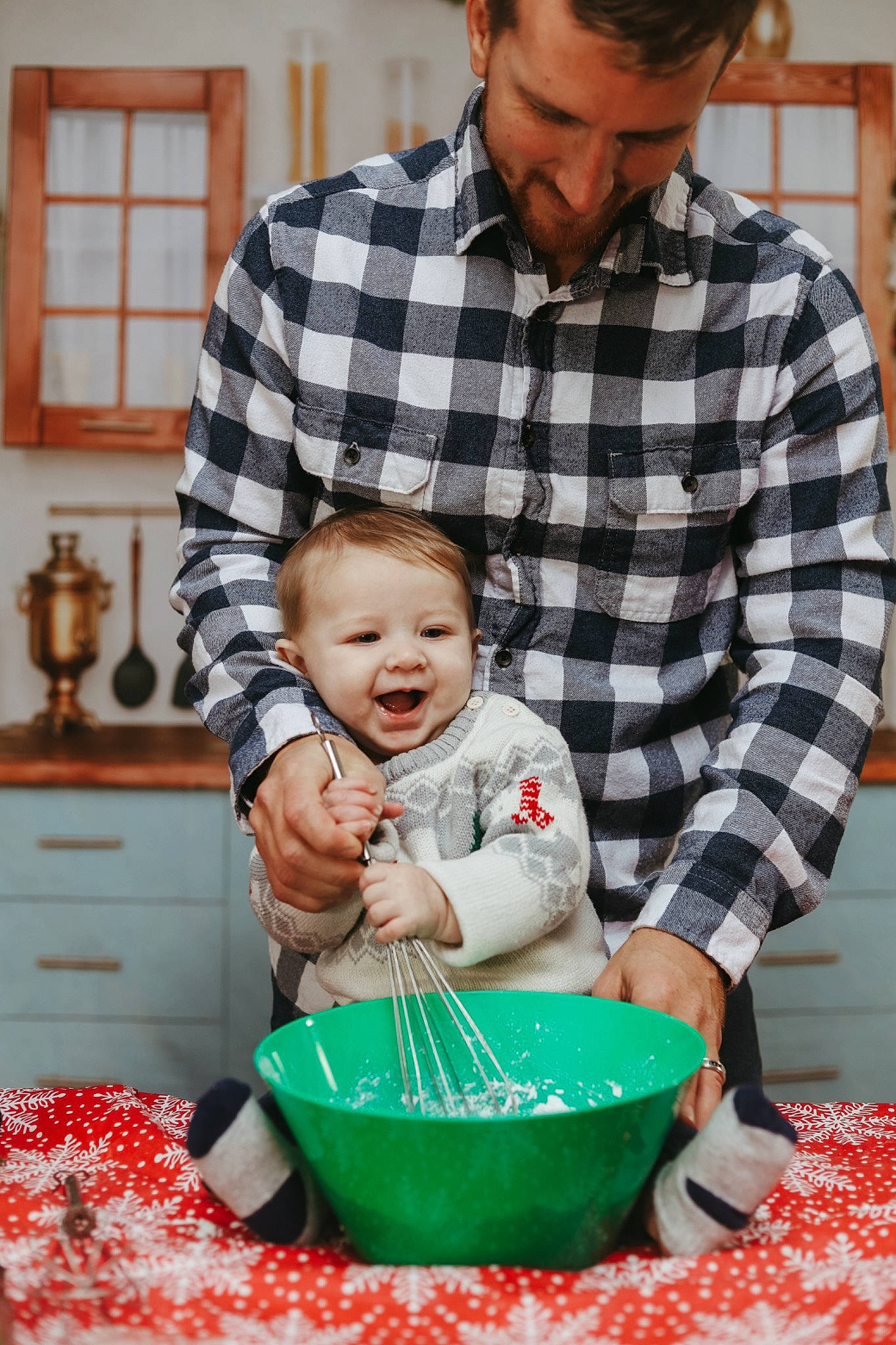 Tanner is registered to the contest to win money with this photo: baby, blue, cabinetry, child, cooking, drawer, event, green, happy, holiday, people, person, plaid, room, shirt, sitting, smile, tableware, tartan, toddler