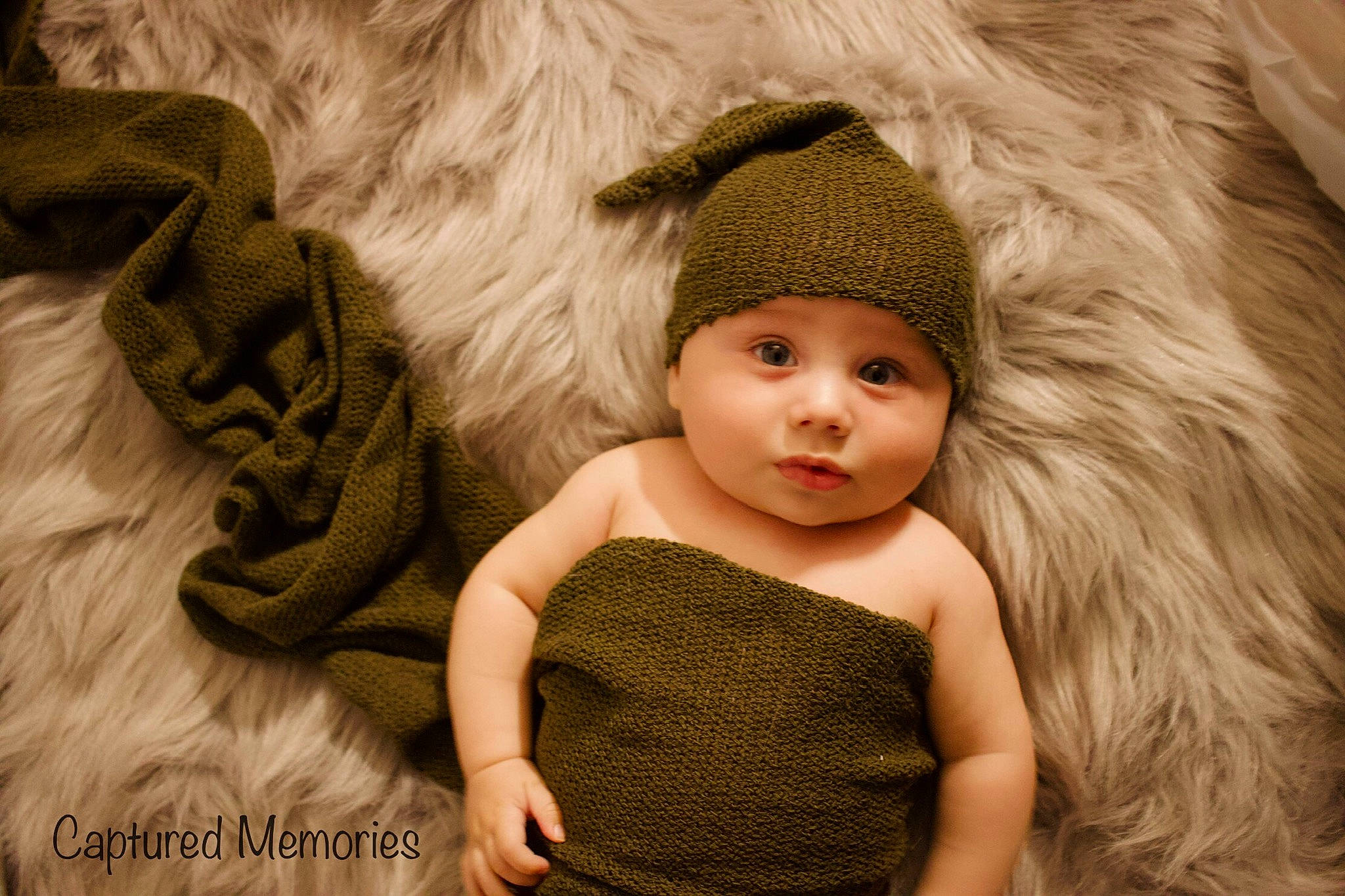 Wesson is registered to the contest to win money with this photo: baby, baby_toddler_clothing, cap, eye, eyelash, face, facial_expression, fawn, flash_photography, grass, hand, happy, headgear, headwear, iris, lip, neck, outerwear, person, skin