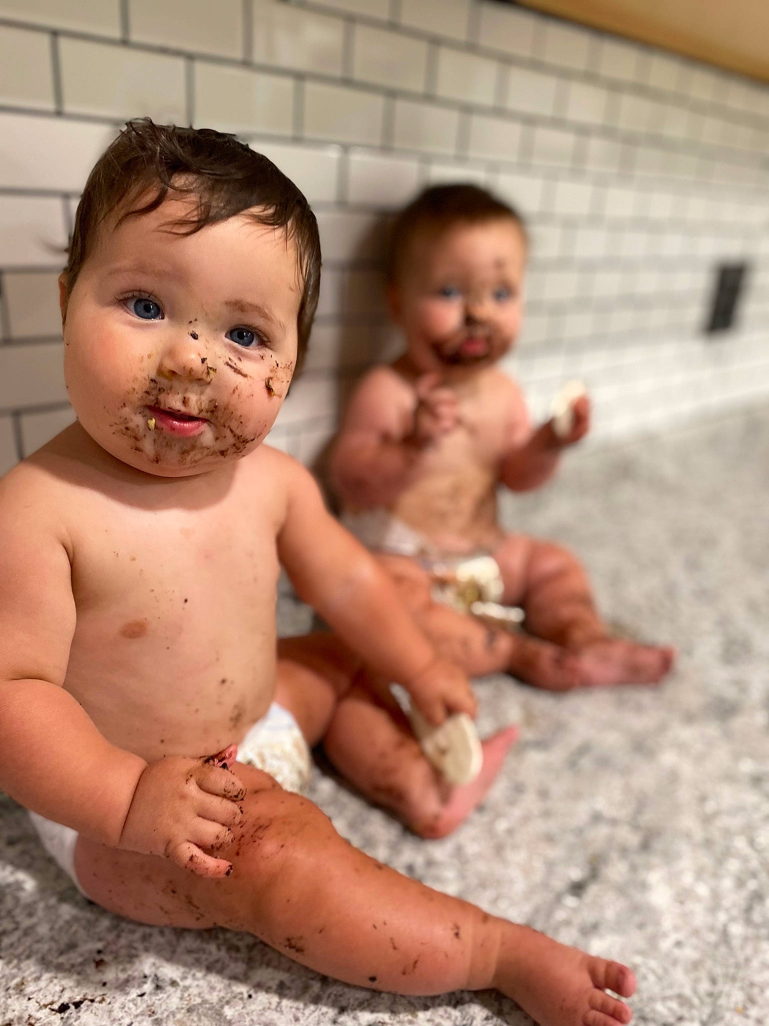 Trace is registered to the contest to win money with this photo: arm, baby, cheek, chest, eye, floor, flooring, fun, gesture, hair, happy, head, human_body, iris, leg, mouth, nose, person, skin, toddler