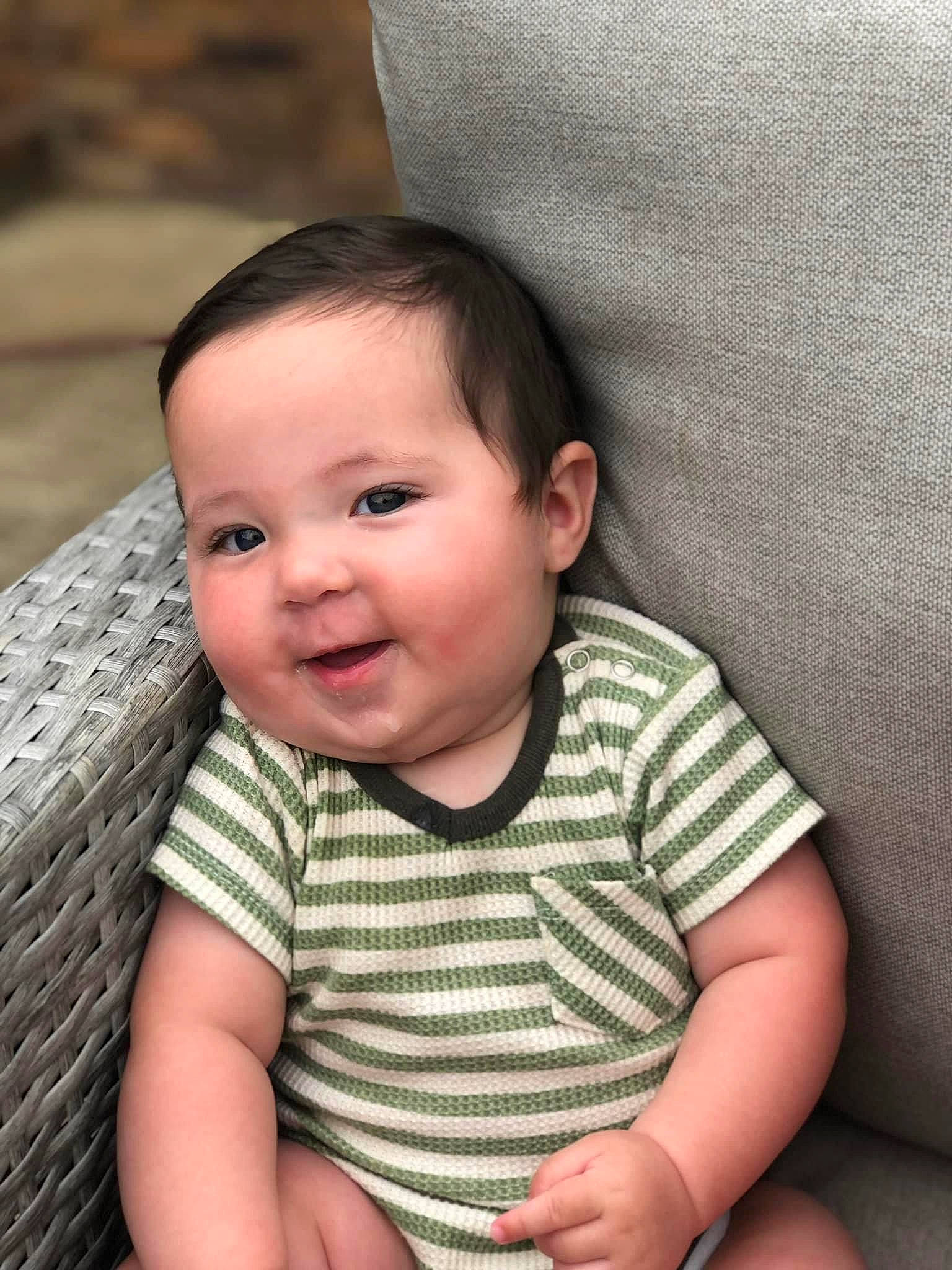 Trace is registered to the contest to win money with this photo: baby, baby_toddler_clothing, cheek, child, chin, comfort, eye, flash_photography, grass, happy, head, iris, lip, mouth, nose, person, skin, sleeve, smile, toddler