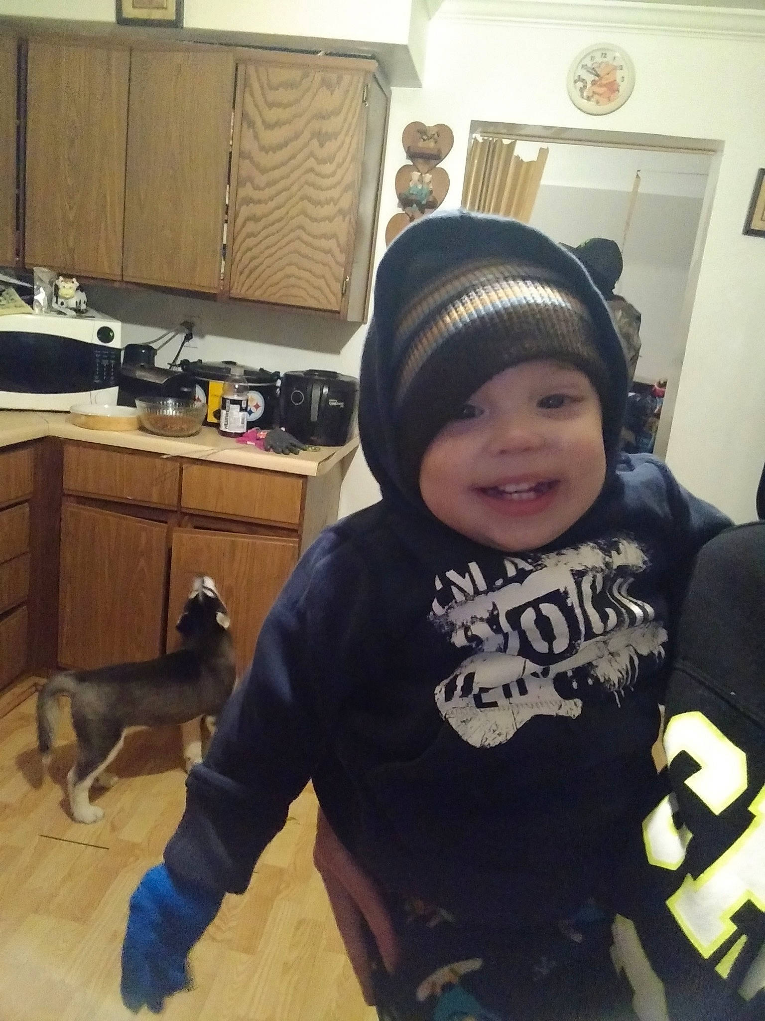 Brenton is registered to the contest to win money with this photo: black_hair, cap, child, cool, head, headgear, headwear, joy, outerwear, person, smile, t_shirt, toddler