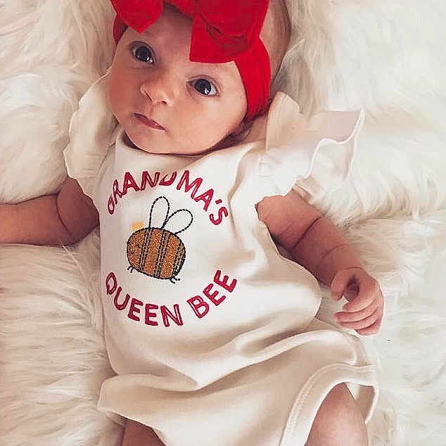 Nina joined the competition — help win amazing prizes! baby, baby_products, baby_toddler_clothing, child, costume, headgear, person, pink, product, red, smile, toddler