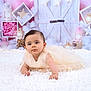 adorable, baby, child, clouds, crawling, cute, decor, dress, fairy_tale, happy, indoors, infant, lanterns, pink_background, portrait, smiling, soft_lighting, stars, white_carpet, young