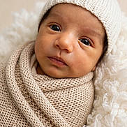 Uziel joined the competition — help win amazing prizes! newborn, baby, infant, portrait, face, eyes, knit_cap, blanket, swaddle, cozy, cream, beige, soft_lighting, close_up, indoors, lying_down, peaceful, adorable, textile, photography