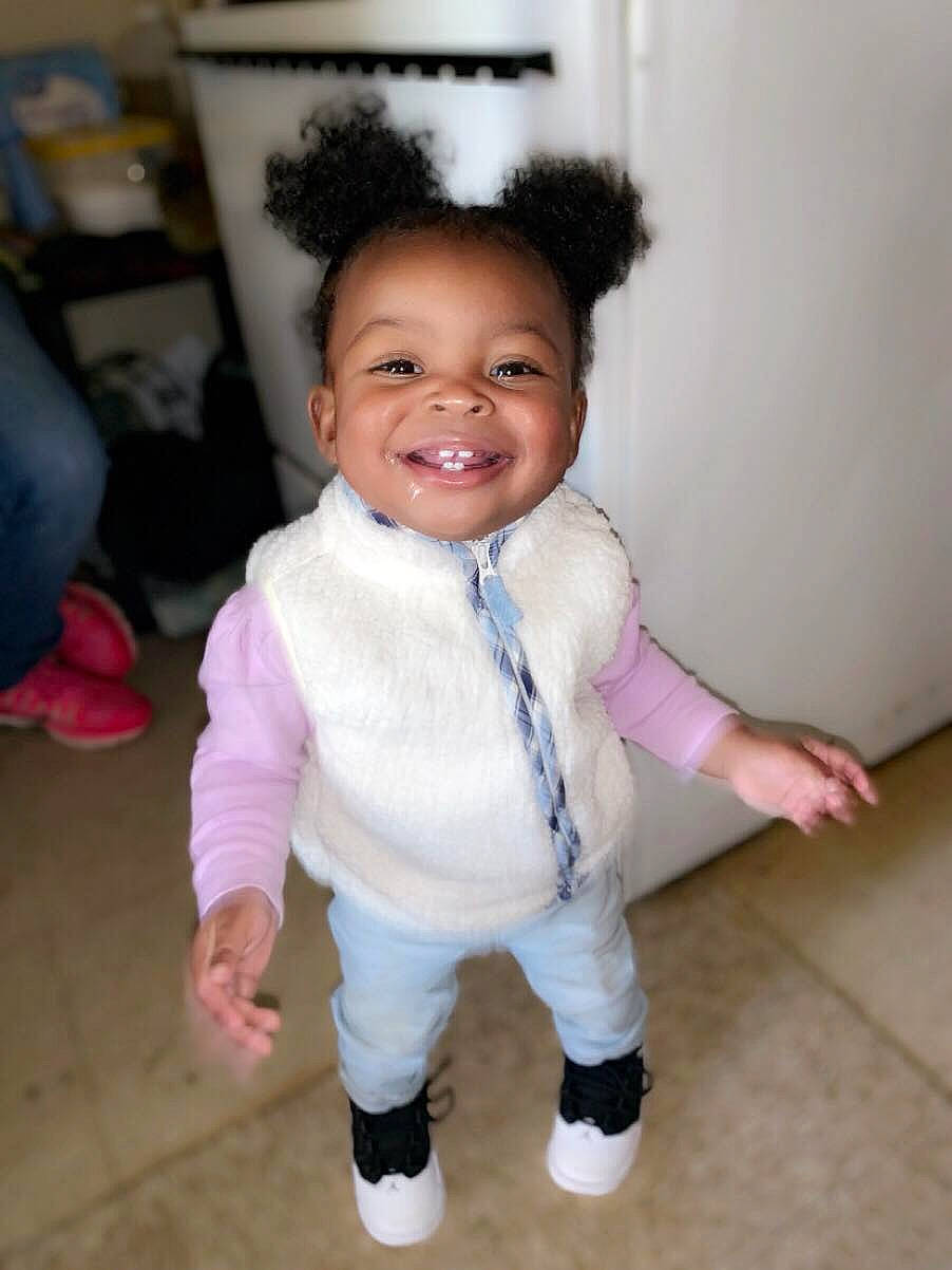 Kailey is registered to the contest to win money with this photo: baby, baby_toddler_clothing, cheek, child, floor, fun, happy, joy, leg, person, pink, shoe, skin, smile, standing, toddler