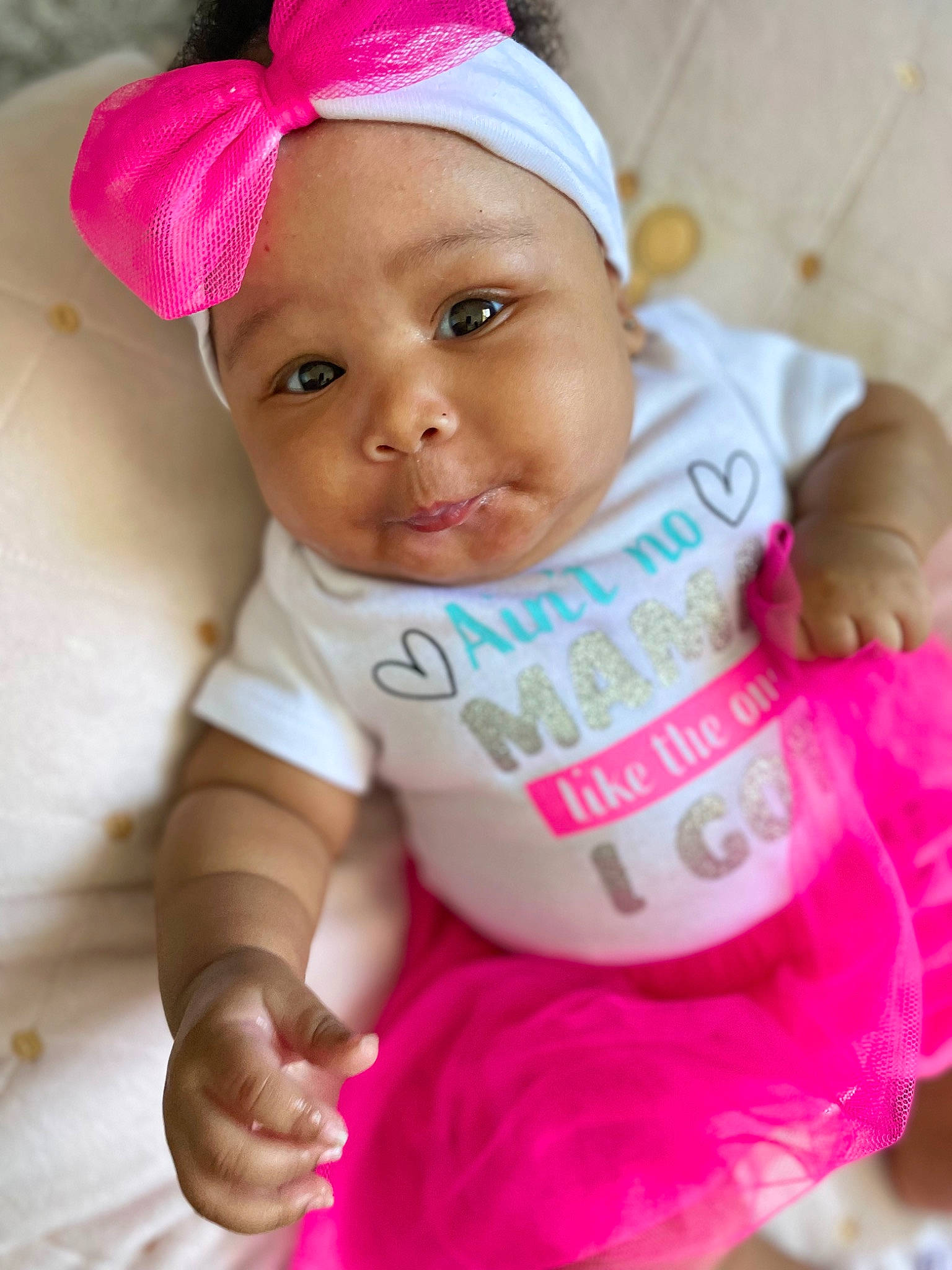 Ailani joined the competition — help win amazing prizes! baby, baby_toddler_clothing, cap, cheek, chin, eyebrow, face, happy, headgear, headwear, lip, nose, outerwear, person, pink, skin, sleeve, smile, t_shirt, textile