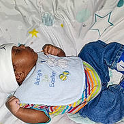 Adore is registered to the contest to win money with this photo: baby, infant, sleeping, clothing, hat, bib, sneakers, blue_shoes, striped_shirt, denim_jeans, blanket, stars, pattern, cute, child, resting, indoors, soft_lighting, peaceful, young