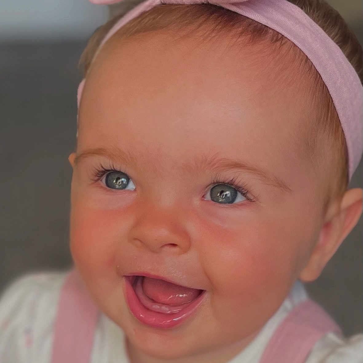 Bodhi joined the competition — help win amazing prizes! baby, blue_eyes, cheerful, child, closeup, clothing, cute, expression, face, happy, headband, indoors, infant, person, pink, portrait, skin, smiling, soft_lighting, young