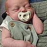 Bennett joined the competition — help win amazing prizes! baby, sleeping, pacifier, infant, clothing, green_outfit, wooden_buttons, hand, arm, face, skin, newborn, closeup, portrait, cozy, striped_fabric, comfort, rest, peaceful, person