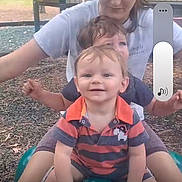 Hudson joined the competition — help win amazing prizes! toddler, child, sibling, playground, slide, park, play_equipment, smile, happy, portrait, sitting, video_screenshot, phone_ui, timestamp, outdoor, clothing, striped_shirt, hands, person, hair