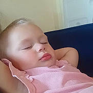 Lorelai joined the competition — help win amazing prizes! toddler, sleeping, child, pink_clothing, relaxing, couch, indoor, face, peaceful, resting, portrait, young_child, casual, comfort, closeup, arm, head, person, skin, calm