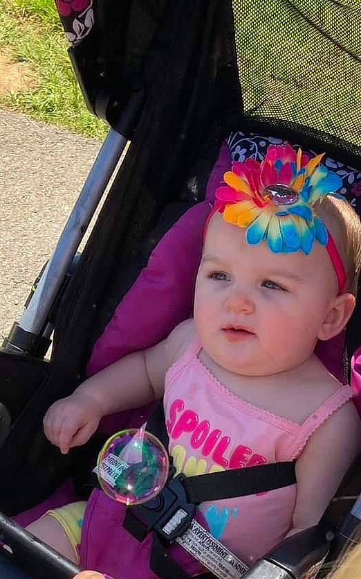 Kensley joined the competition — help win amazing prizes! baby, baby_carriage, baby_products, baby_toddler_clothing, car_seat, child, costume_hat, fashion_accessory, fun, grass, happy, hat, headband, headpiece, headwear, magenta, person, pink, plant, steering_wheel
