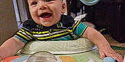 Jensen joined the competition — help win amazing prizes! activity_center, baby, child, clothing, colorful, cute, face, furniture, hand, happy, indoor, infant, person, plastic, play, seat, smiling, striped_shirt, toy, walker